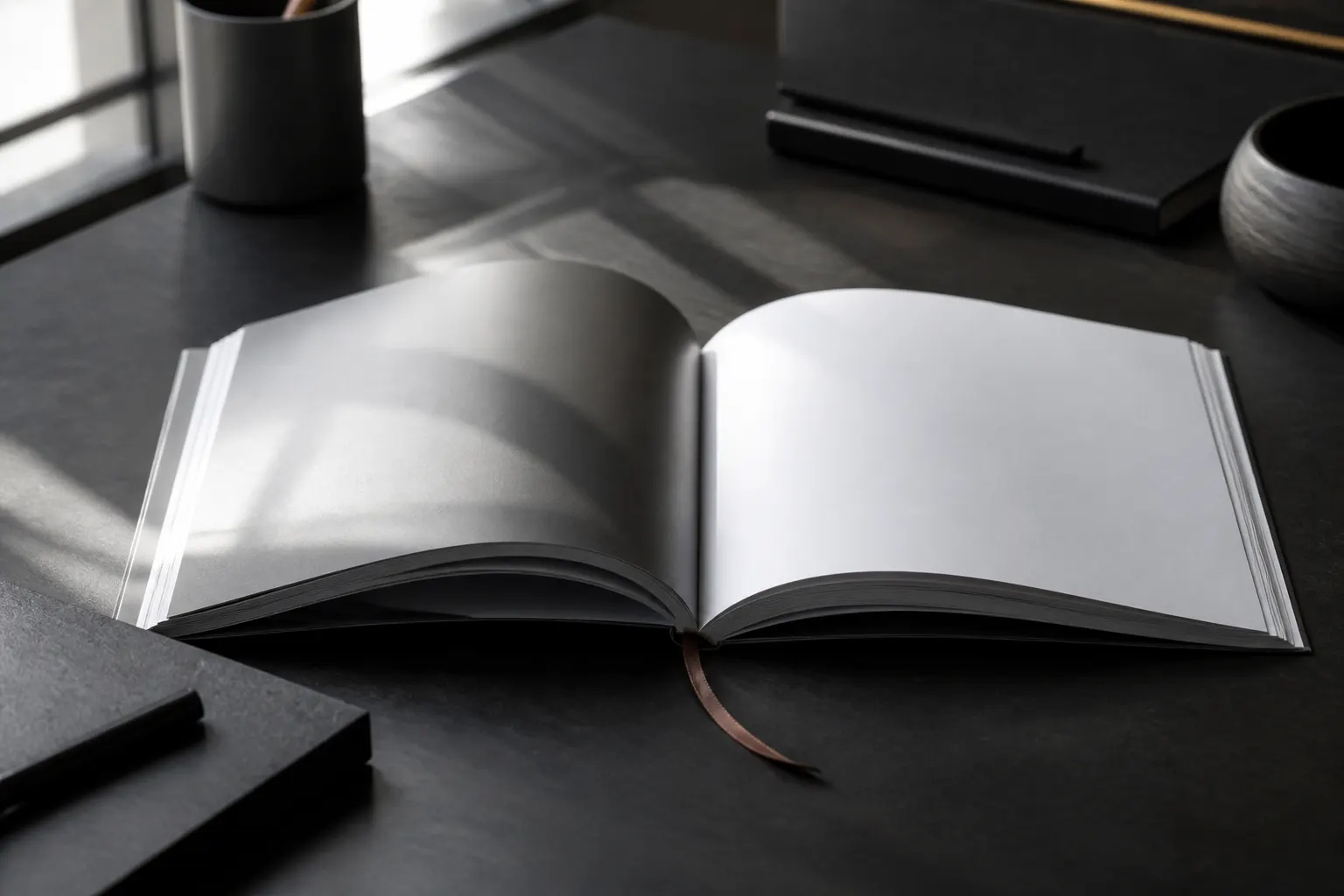 Print-ready company profile booklet photographed on a charcoal studio desk